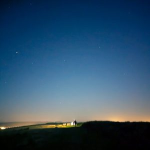 Runners on the Garth at night